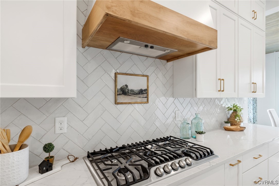 15124 Heaton Drive Midlothian, VA 23112 - Photo 18 of 49 a kitchen with a stove and a white cabinets
