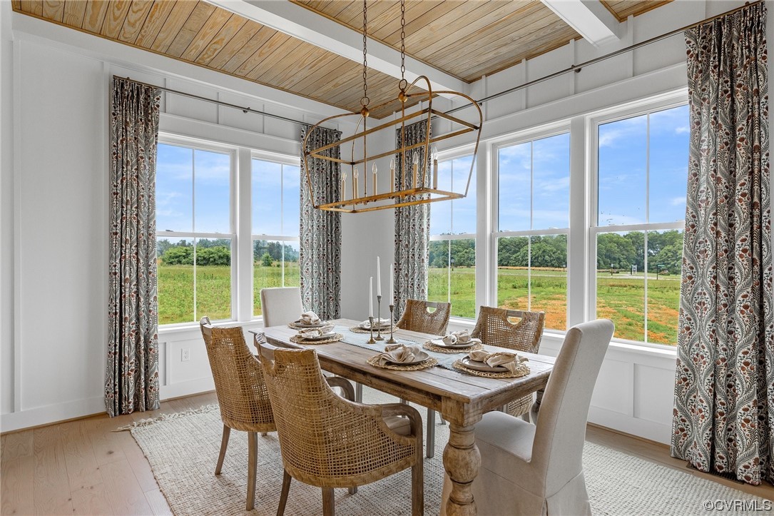 15124 Heaton Drive Midlothian, VA 23112 - Photo 20 of 49 a view of a dining room with furniture large windows and wooden floor