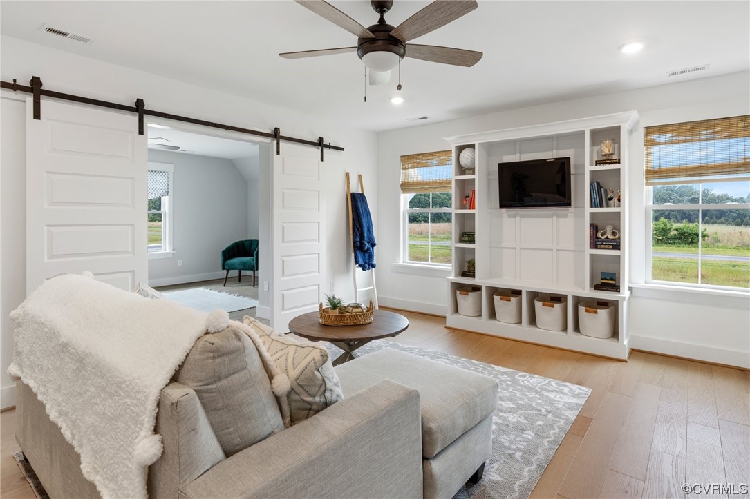 15124 Heaton Drive Midlothian, VA 23112 - Photo 24 of 49 a living room with furniture and a flat screen tv
