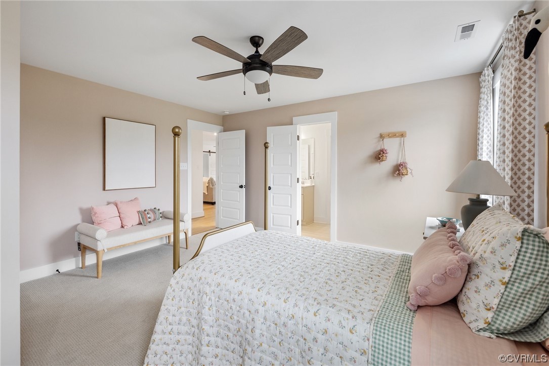 15124 Heaton Drive Midlothian, VA 23112 - Photo 32 of 49 a bedroom with a bed and a chandelier