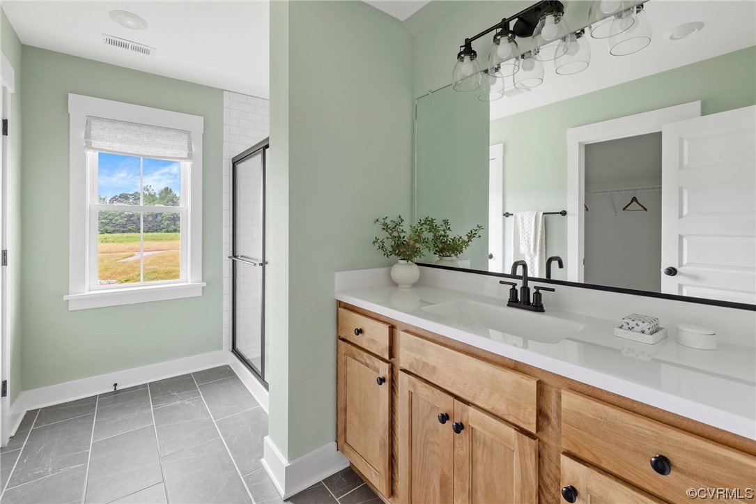 15124 Heaton Drive Midlothian, VA 23112 - Photo 35 of 49 a bathroom with a sink and a mirror