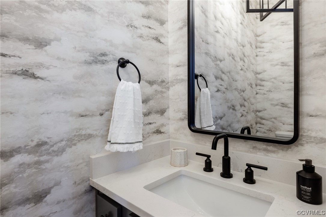 15124 Heaton Drive Midlothian, VA 23112 - Photo 42 of 49 a bathroom with a sink and a mirror