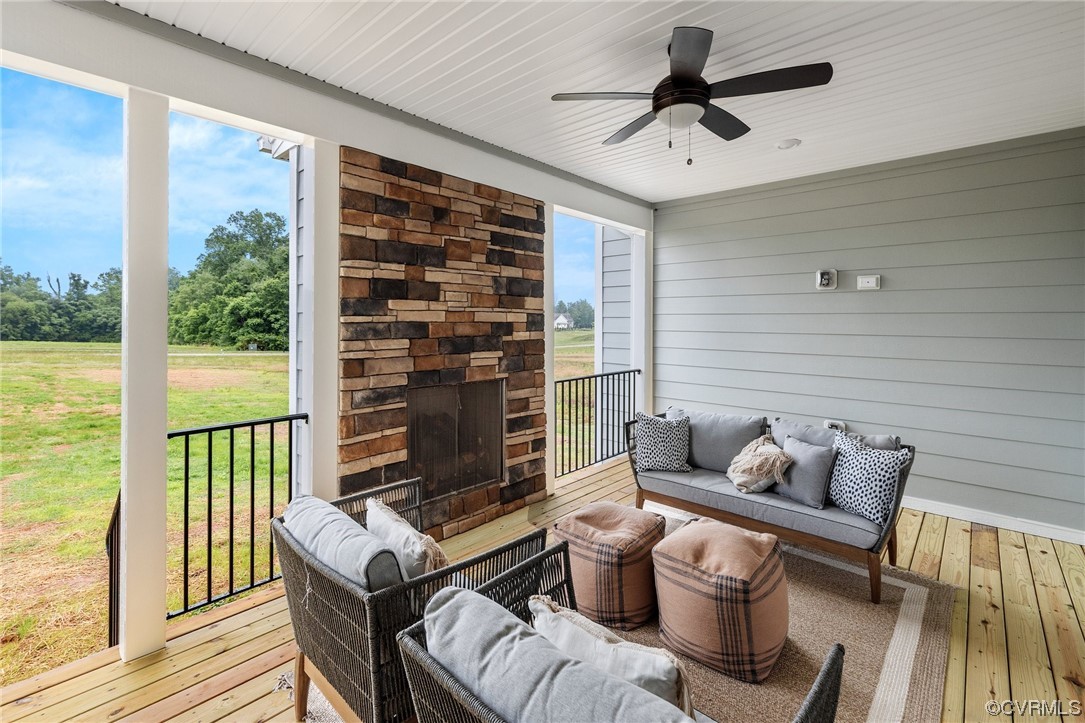 15124 Heaton Drive Midlothian, VA 23112 - Photo 43 of 49 a living room with furniture and a floor to ceiling window