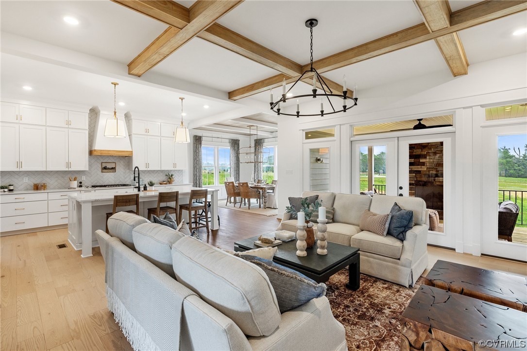 15124 Heaton Drive Midlothian, VA 23112 - Photo 6 of 49 a living room with furniture kitchen view and a chandelier