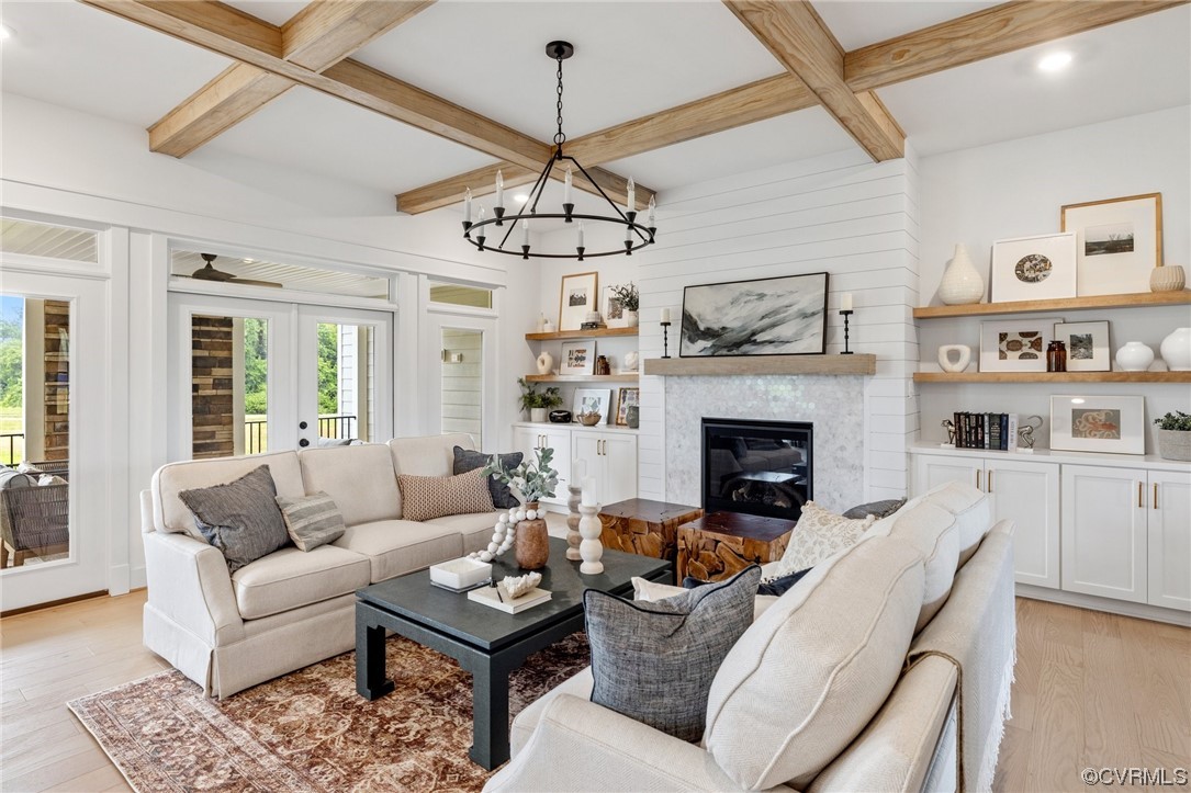 15124 Heaton Drive Midlothian, VA 23112 - Photo 7 of 49 a living room with furniture a chandelier and a fireplace