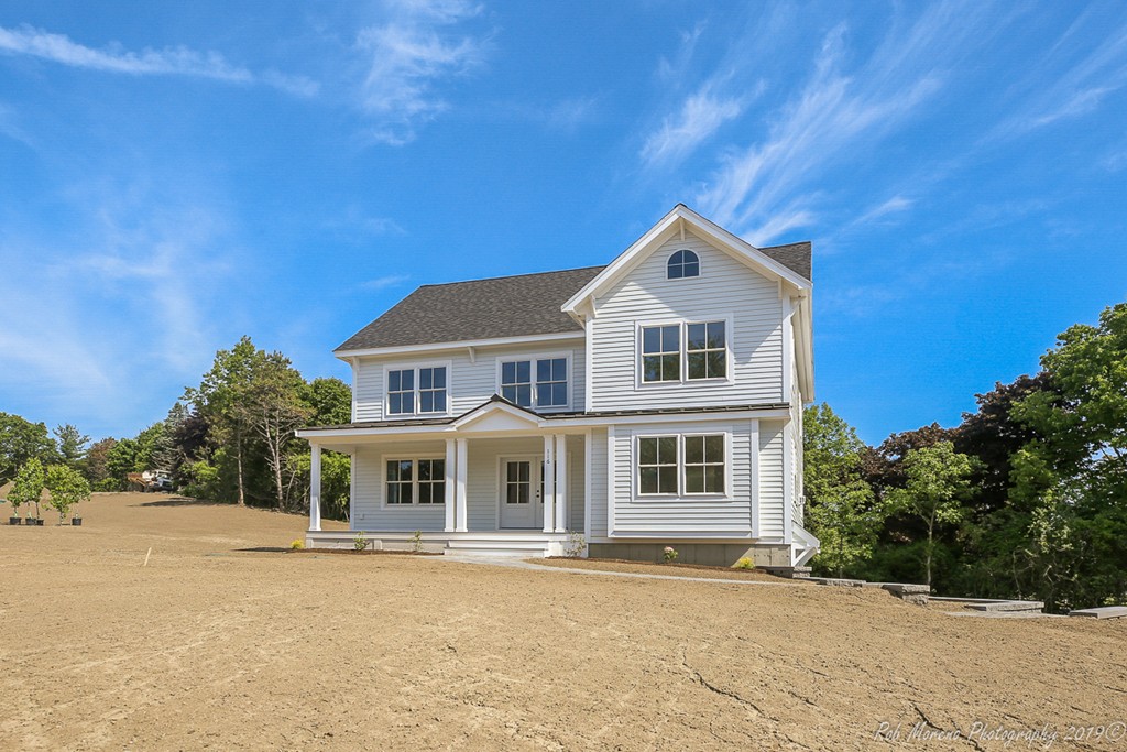 116 Bennett Hill Road Rowley, MA 01969 - Photo 1 of 39 a front view of a house with a yard