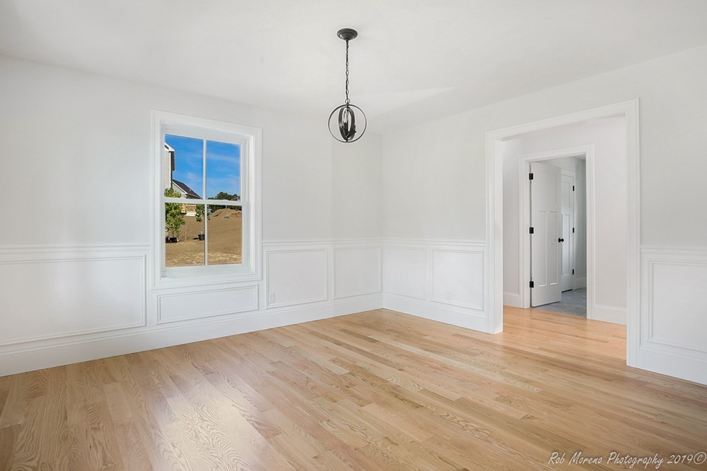 116 Bennett Hill Road Rowley, MA 01969 - Photo 17 of 39 an empty room with windows and cabinet