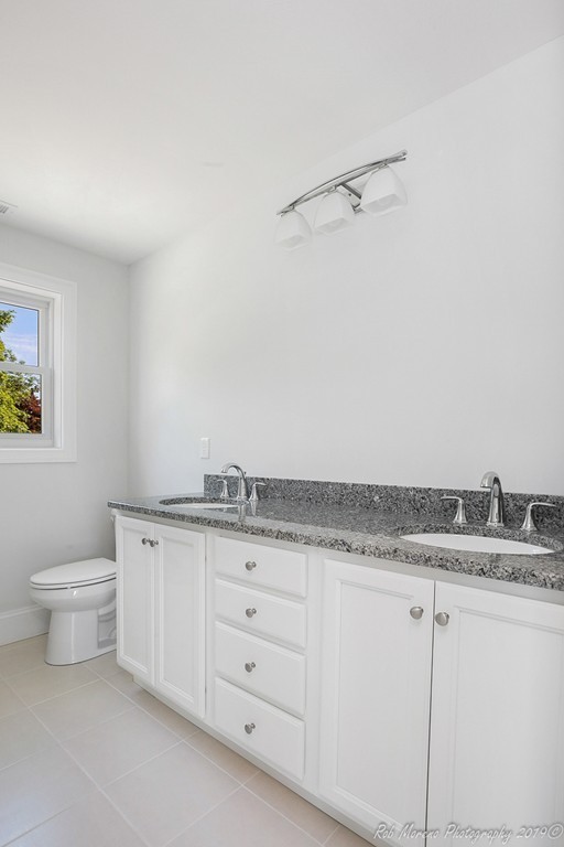 116 Bennett Hill Road Rowley, MA 01969 - Photo 22 of 39 a bathroom with a granite countertop sink and toilet