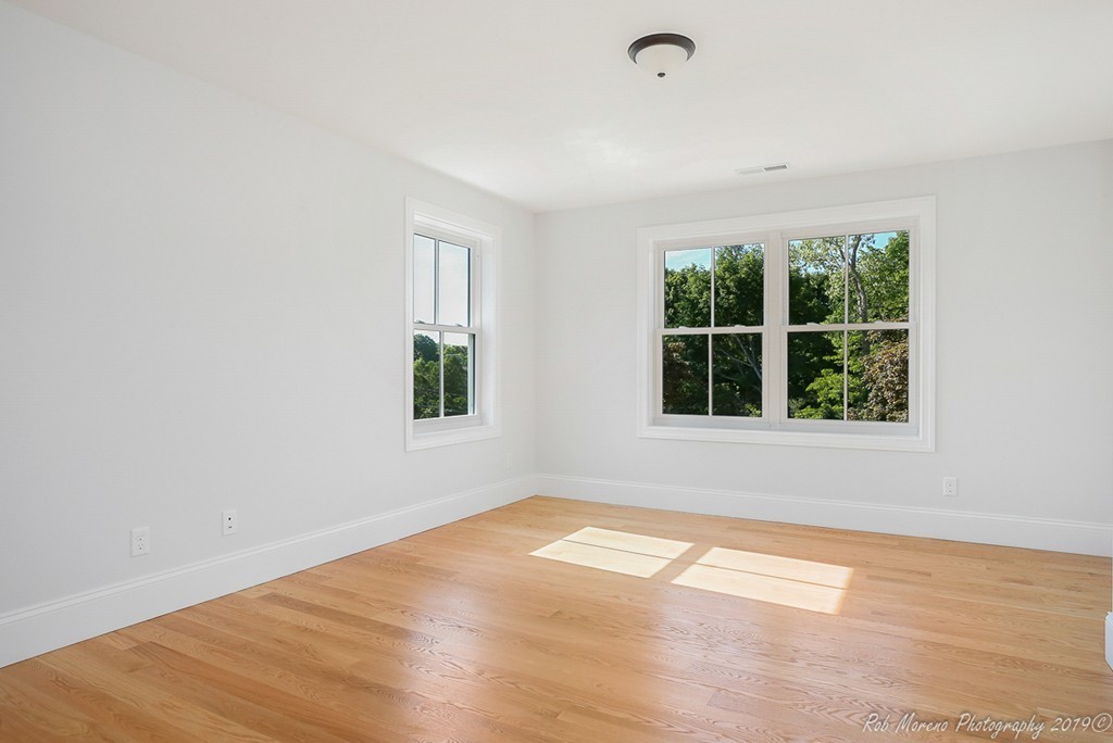 116 Bennett Hill Road Rowley, MA 01969 - Photo 25 of 39 an empty room with wooden floor and windows