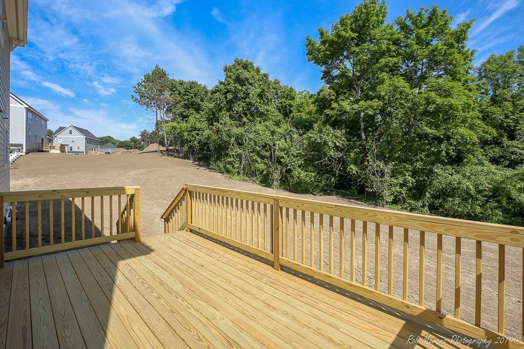 116 Bennett Hill Road Rowley, MA 01969 - Photo 35 of 39 a view of balcony with wooden floor and fence