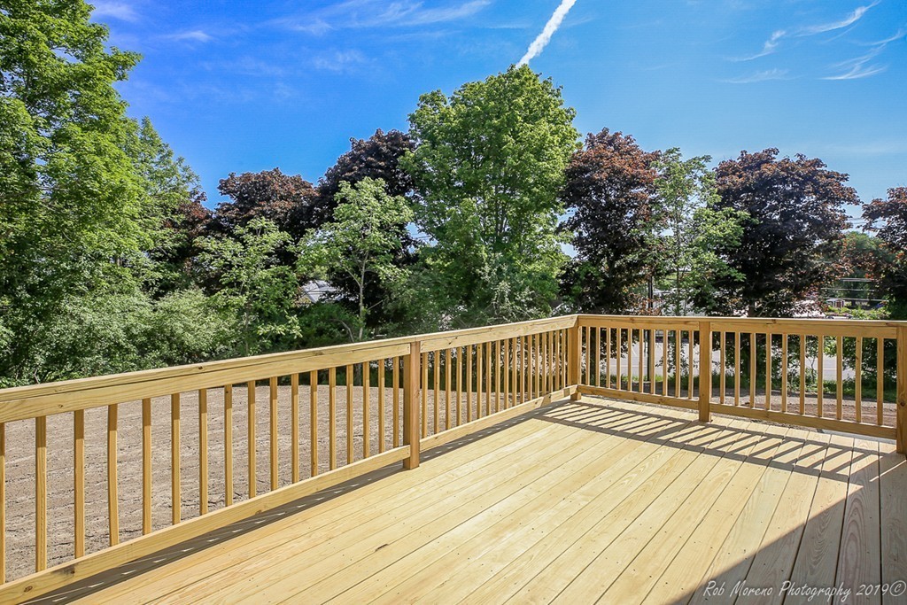 116 Bennett Hill Road Rowley, MA 01969 - Photo 36 of 39 a view of balcony with wooden floor and fence
