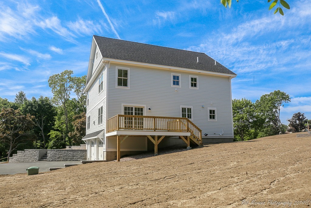 116 Bennett Hill Road Rowley, MA 01969 - Photo 38 of 39 a front view of a house with a yard