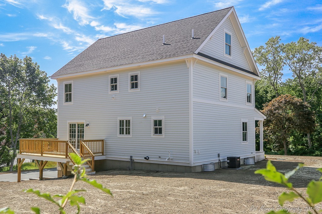 116 Bennett Hill Road Rowley, MA 01969 - Photo 39 of 39 a view of a backyard with a sitting area