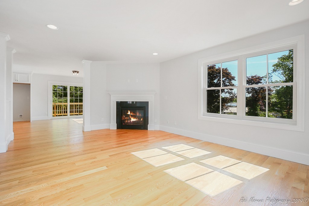 116 Bennett Hill Road Rowley, MA 01969 - Photo 8 of 39 a view of an empty room with glass door and windows