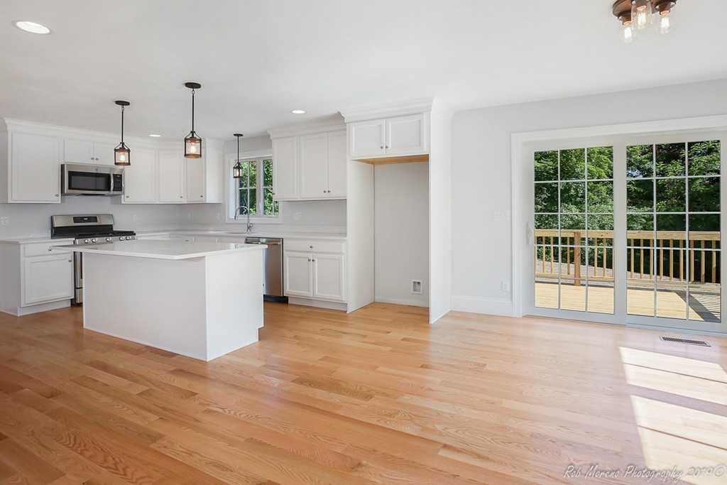 116 Bennett Hill Road Rowley, MA 01969 - Photo 9 of 39 a view of kitchen with stainless steel appliances granite countertop a stove top oven a sink and a refrigerator