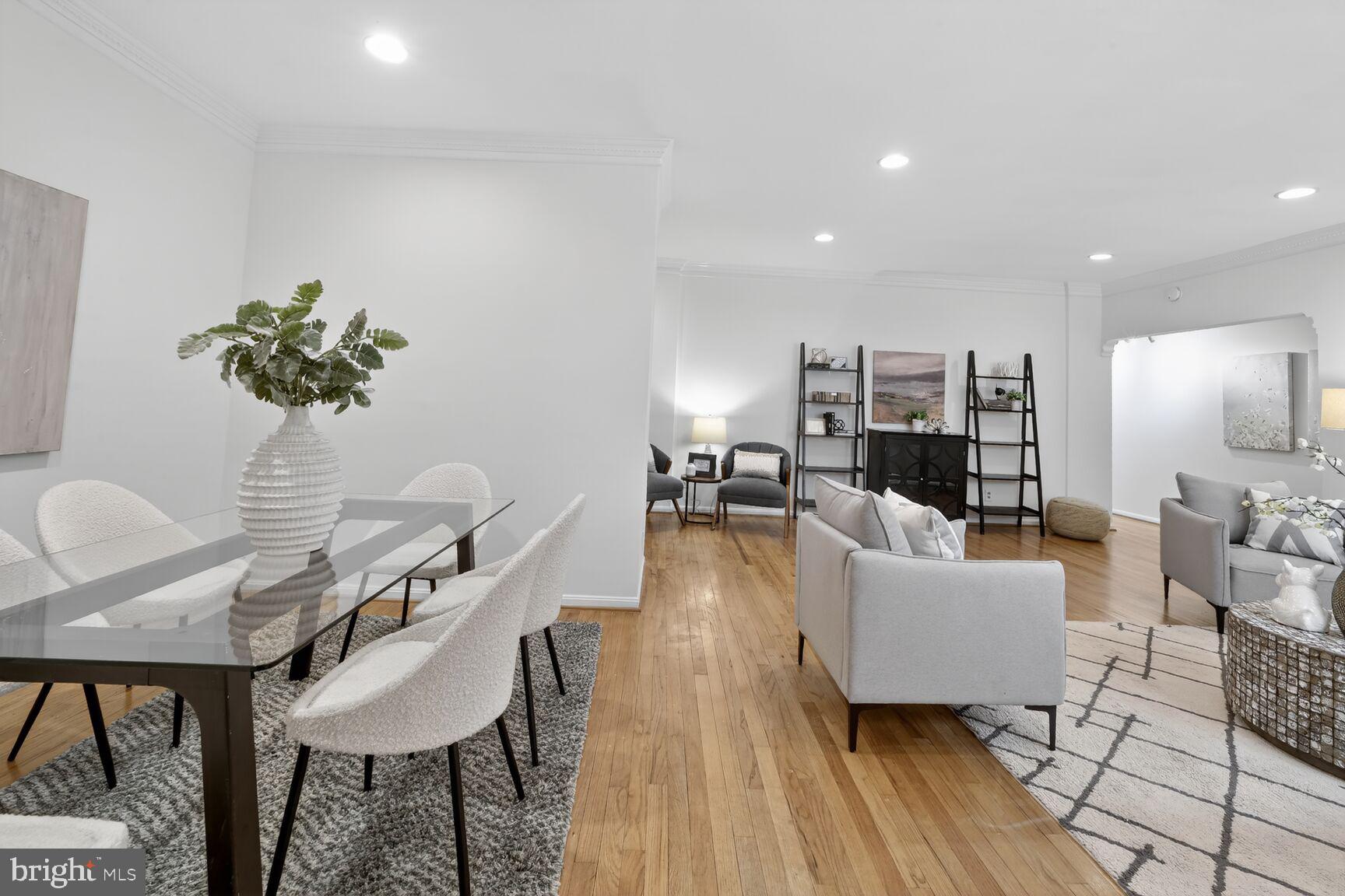 1669 Columbia Road Northwest, Unit 313 Washington, DC 20009 - Photo 12 of 20 a living room with furniture and a wooden floor