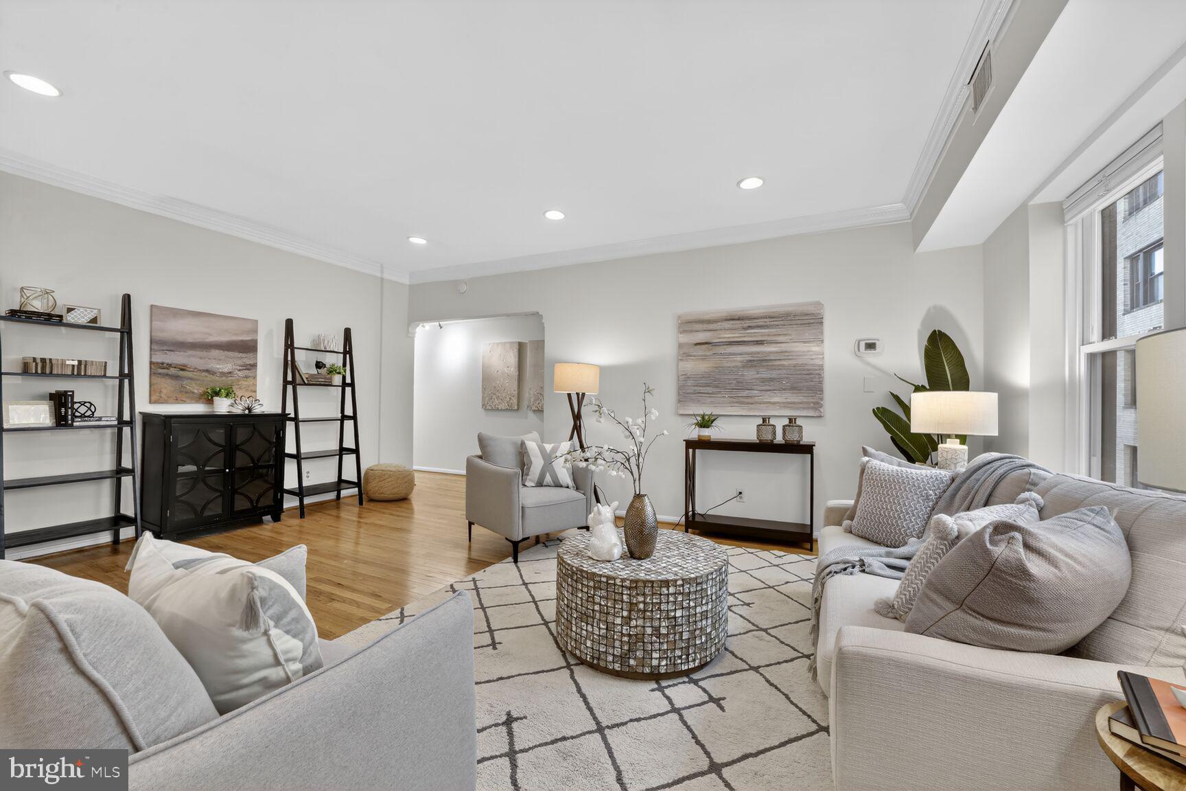 1669 Columbia Road Northwest, Unit 313 Washington, DC 20009 - Photo 8 of 20 a living room with furniture and a fireplace