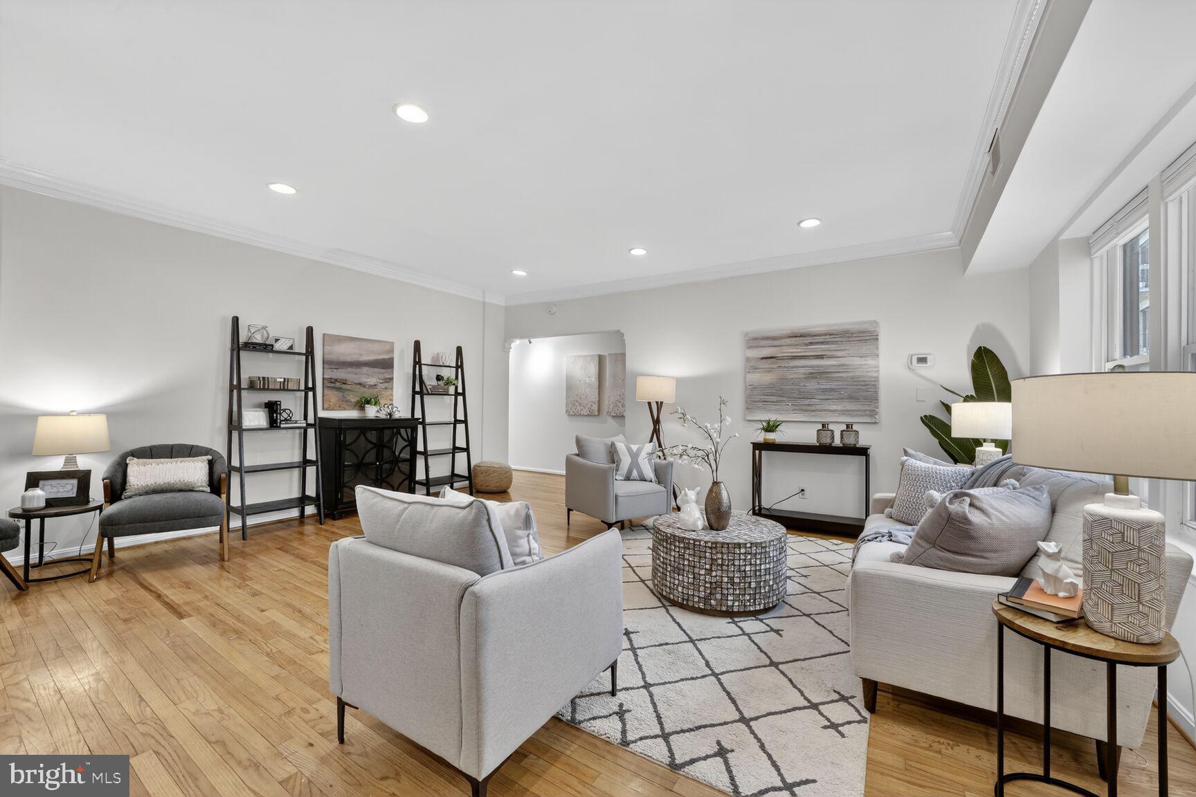1669 Columbia Road Northwest, Unit 313 Washington, DC 20009 - Photo 9 of 20 a living room with furniture and a wooden floor