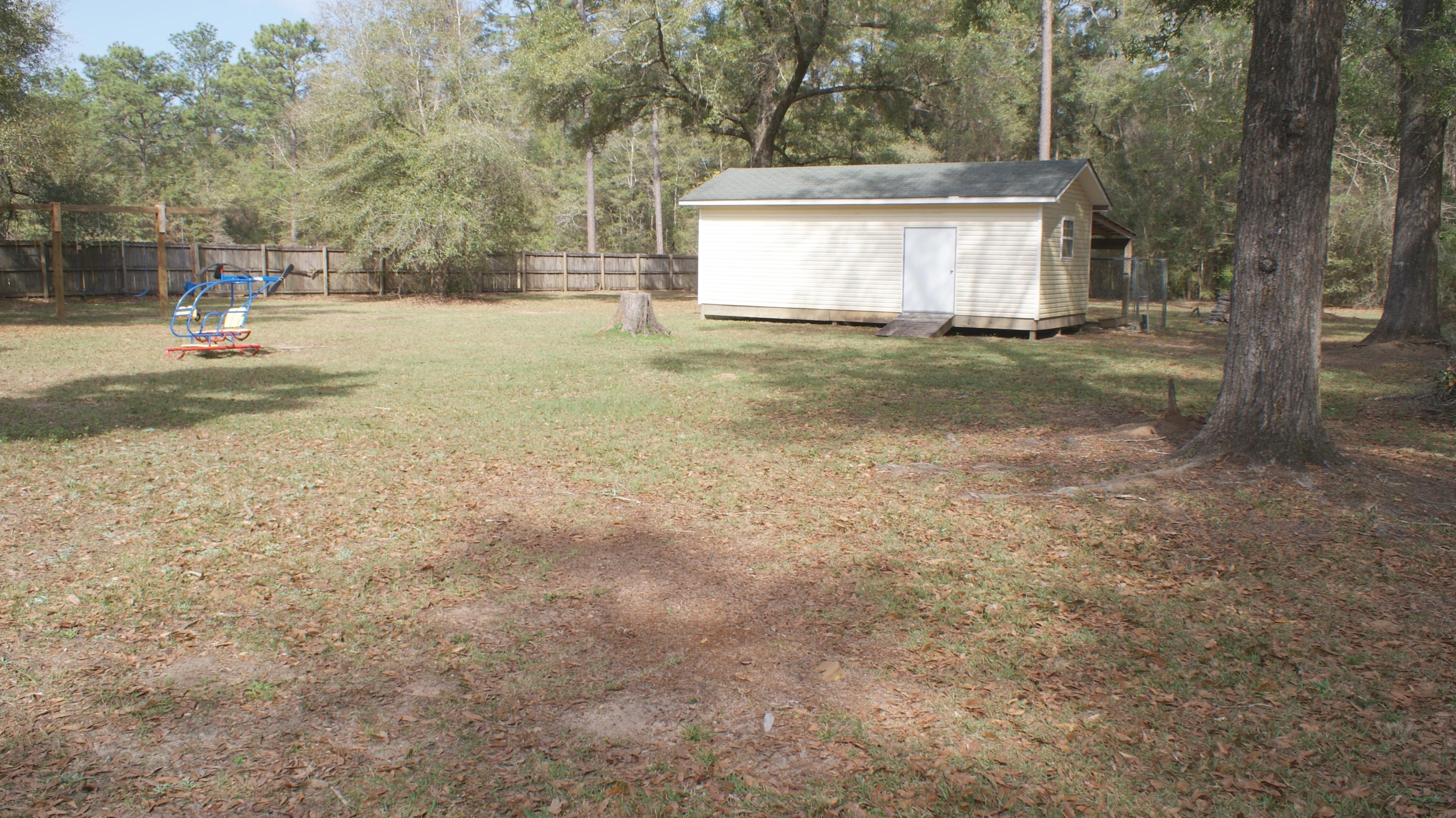 897 Lighthouse Church Road Holt, FL 32564 - Photo 5 of 15 a view of a house with yard and tree s
