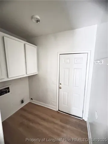 a view of small space with wooden floor