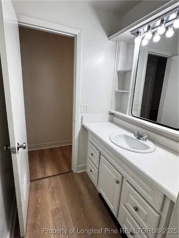 a bathroom with a double vanity sink and mirror