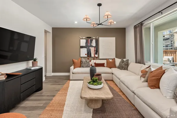 a living room with furniture and a flat screen tv