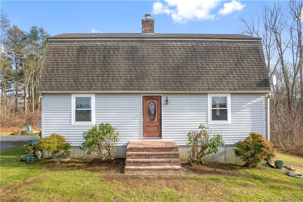 38 Burdick Road Preston, CT 06365 - Photo 1 of 1 a front view of a house with garden