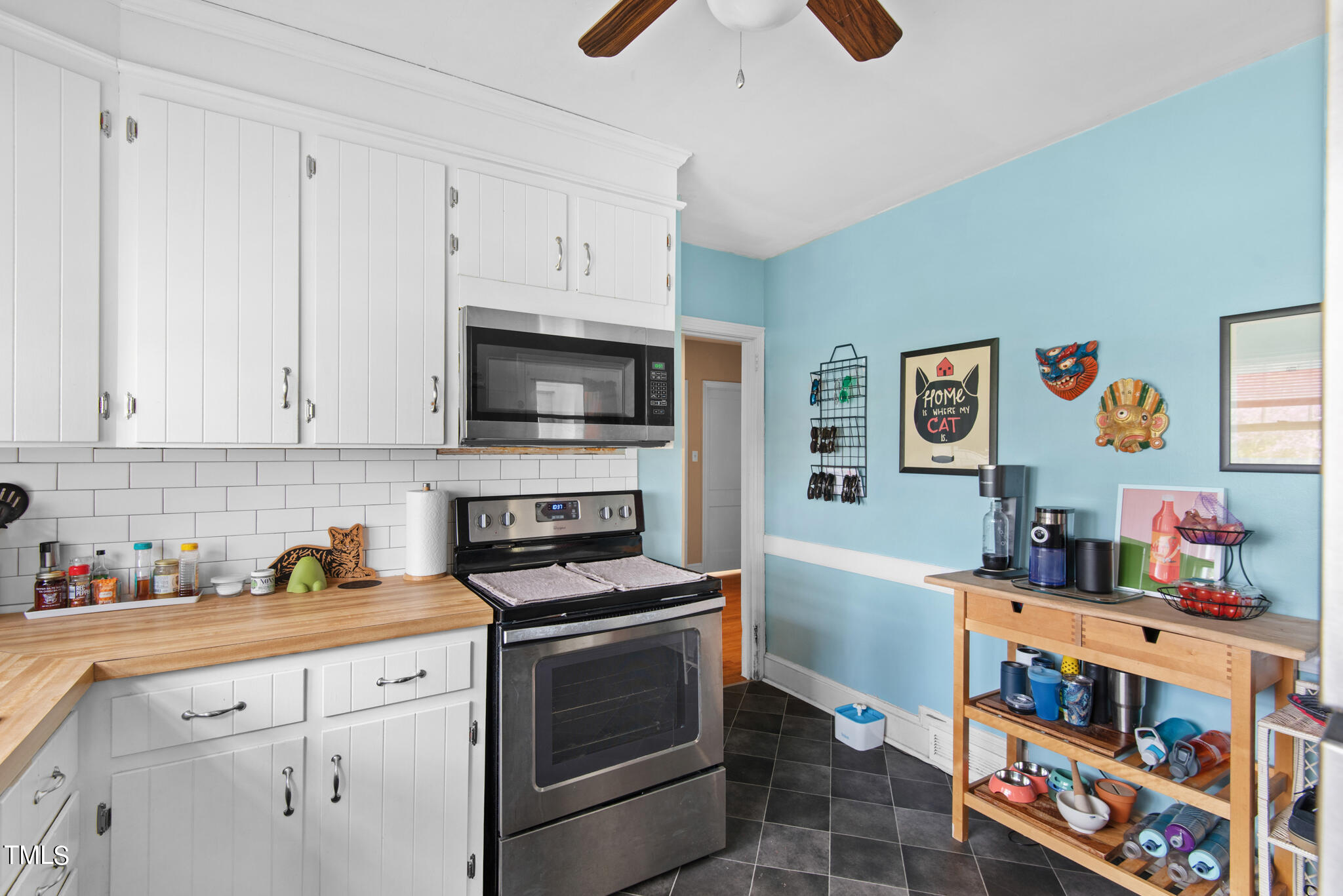 2410 Garner Road Raleigh, NC 27610 - Photo 17 of 32 a kitchen with stainless steel appliances cabinets and a window