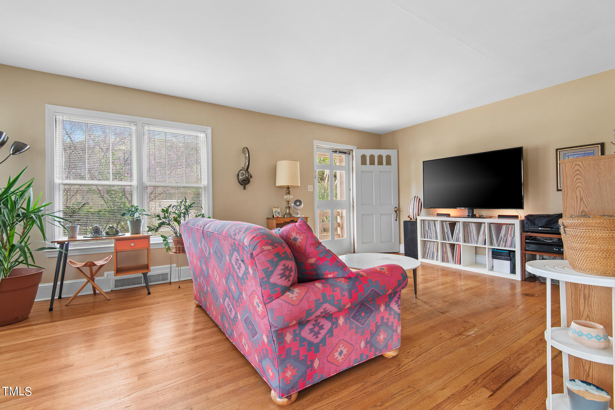 2410 Garner Road Raleigh, NC 27610 - Photo 10 of 32 a living room with furniture and a flat screen tv