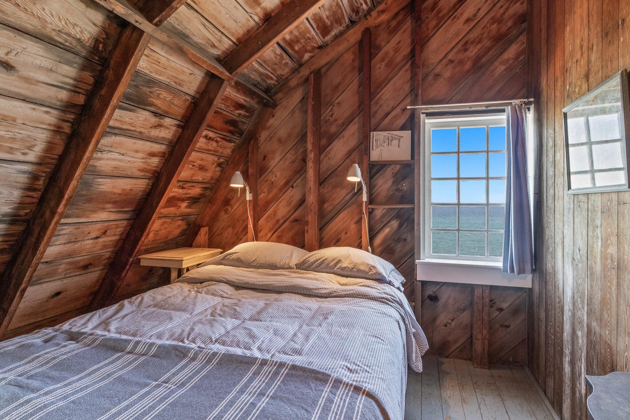 8 Pilgrims Path Truro, MA 02666 - Photo 25 of 49 a bedroom with a bed and a window