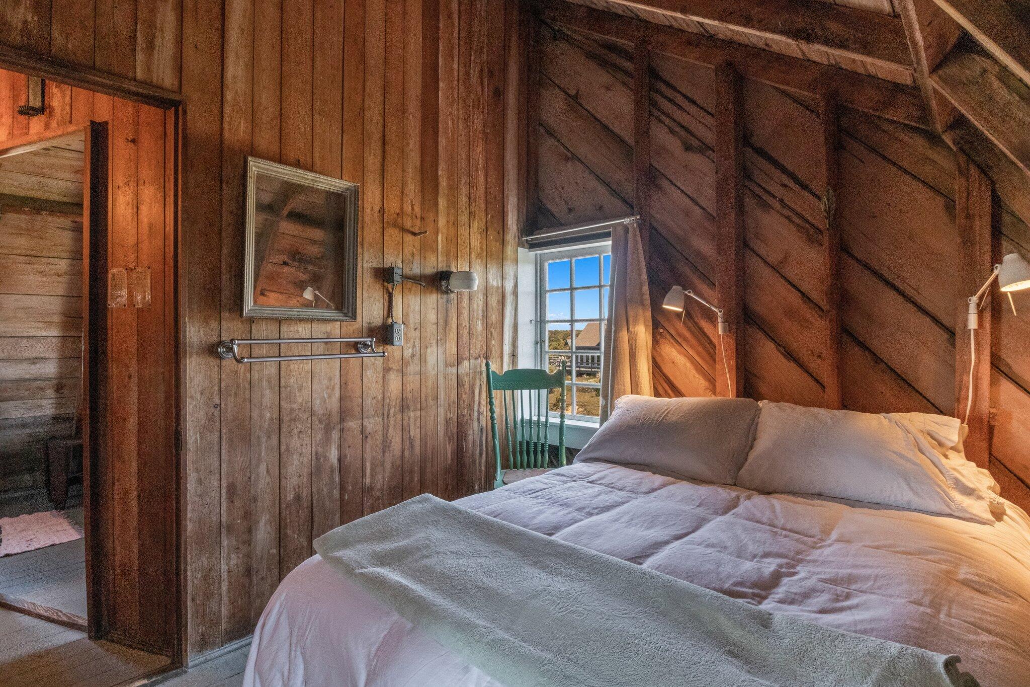 8 Pilgrims Path Truro, MA 02666 - Photo 27 of 49 a bedroom with a bed and a window
