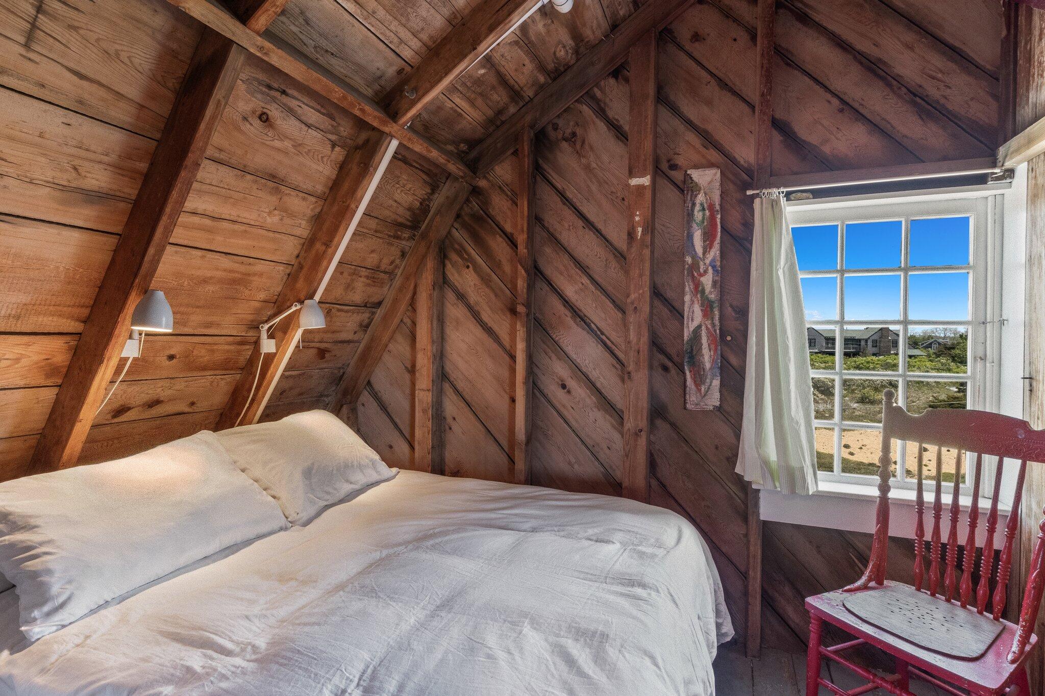 8 Pilgrims Path Truro, MA 02666 - Photo 29 of 49 a bedroom with a bed and a window