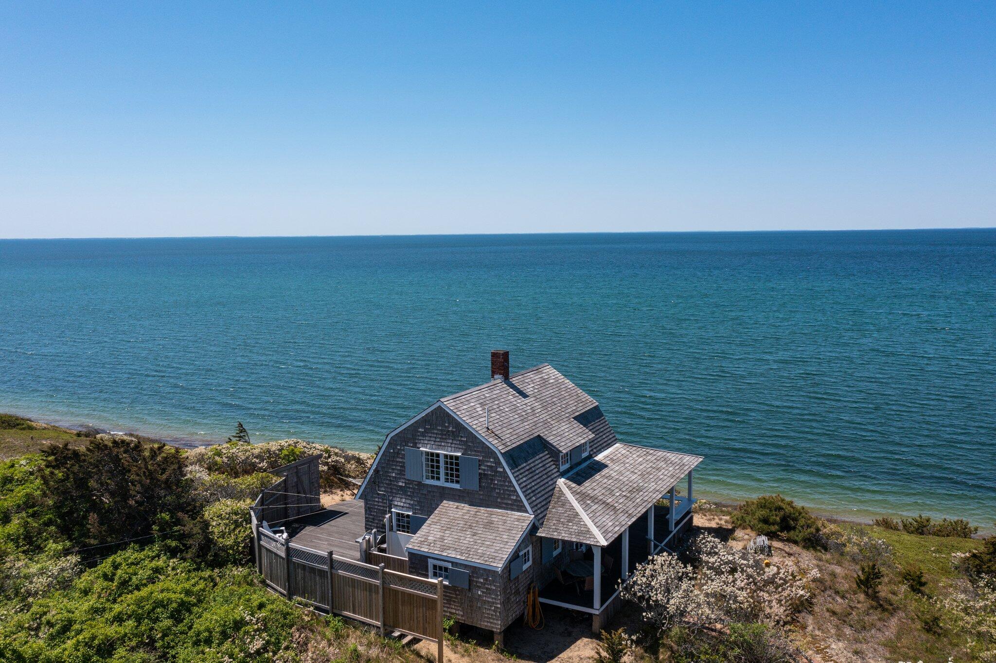 8 Pilgrims Path Truro, MA 02666 - Photo 3 of 49 a view of a lake with a mountain