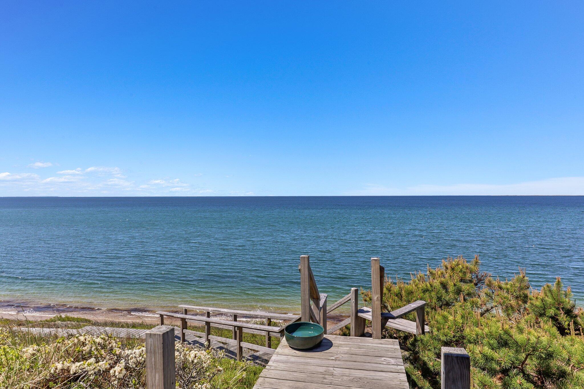 8 Pilgrims Path Truro, MA 02666 - Photo 34 of 49 a view of an ocean from a balcony