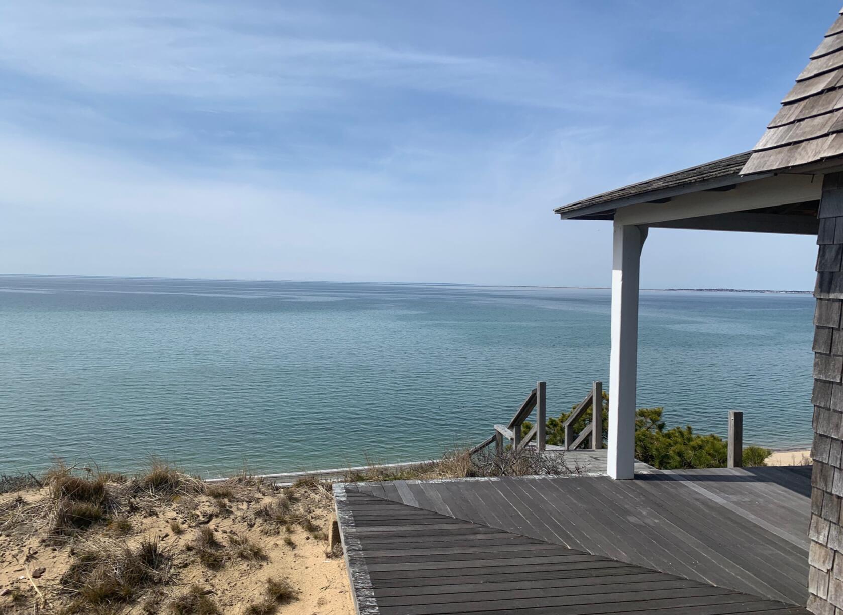 8 Pilgrims Path Truro, MA 02666 - Photo 6 of 49 a view of ocean from a balcony