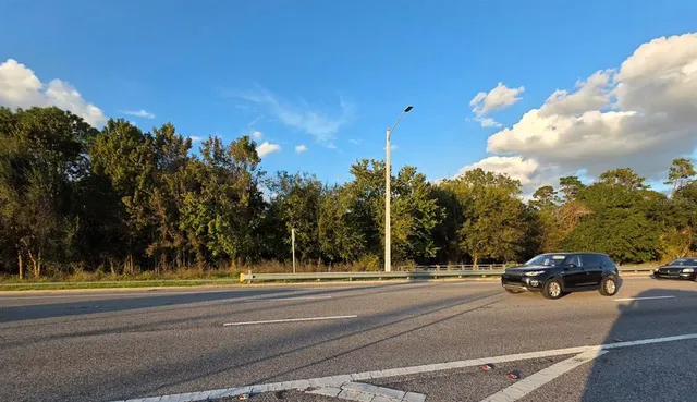 a view of street with parked cars