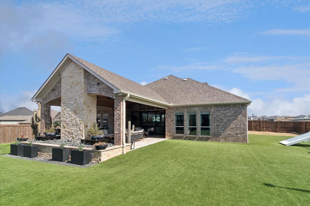 582 Broadleaf Way Haslet, TX 76052 - Photo 32 of 40 Completely turfed backyard for ease of maintenance and beauty.