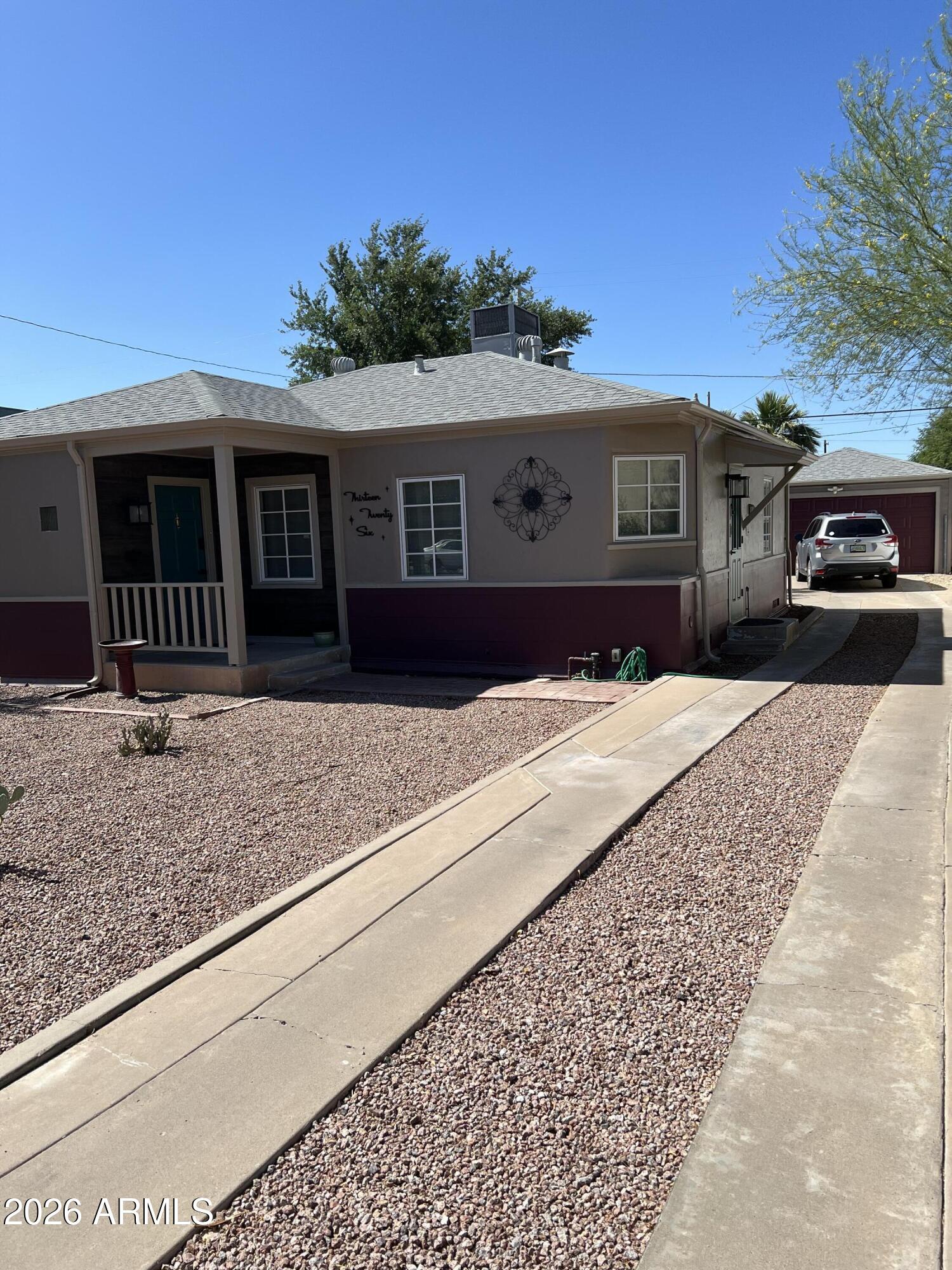 1326 East Coronado Road Phoenix, AZ 85006 - Photo 2 of 36 a front view of a house with a yard