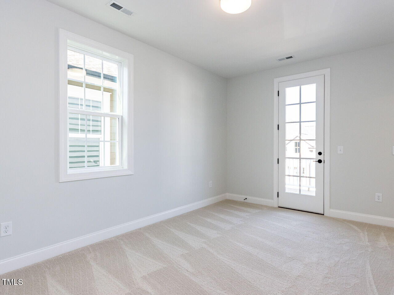 809 St Charles Street Durham, NC 27713 - Photo 27 of 43 an empty room with windows