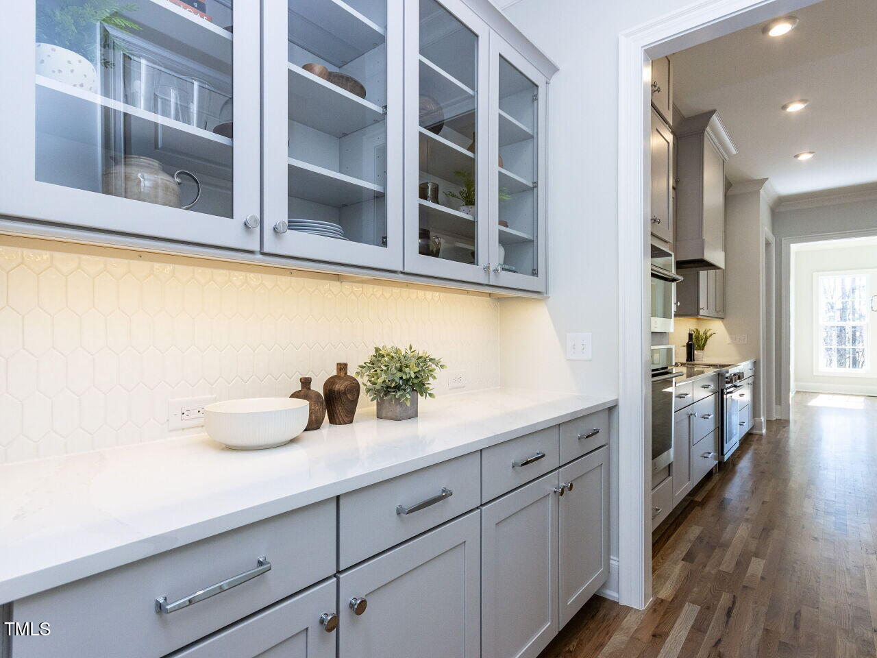 809 St Charles Street Durham, NC 27713 - Photo 5 of 43 a kitchen with stainless steel appliances a sink and wooden floor