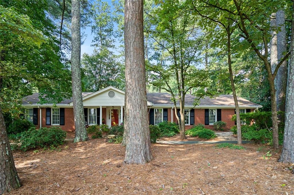 3698 Embry Circle Atlanta, GA 30341 - Photo 2 of 43 a front view of a house with a garden