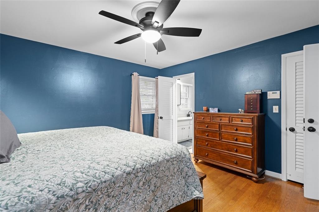 3698 Embry Circle Atlanta, GA 30341 - Photo 22 of 43 a bed room with a bed and a ceiling fan
