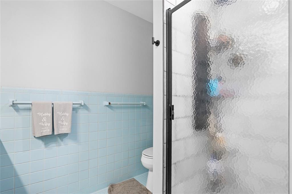 3698 Embry Circle Atlanta, GA 30341 - Photo 25 of 43 a bathroom with a shower and toilet