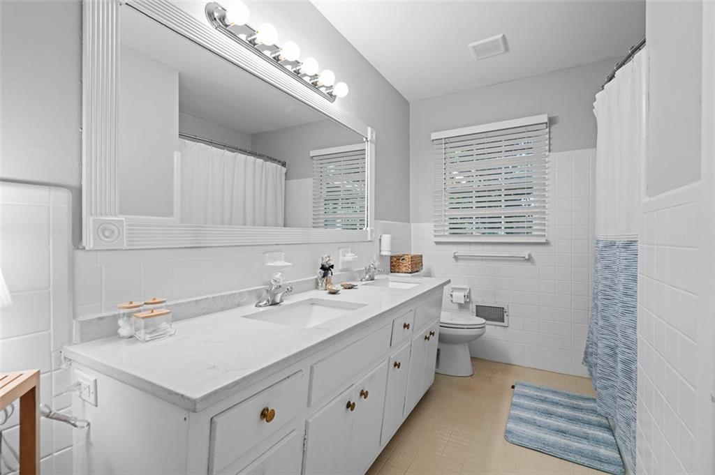 3698 Embry Circle Atlanta, GA 30341 - Photo 28 of 43 a bathroom with a sink and a mirror