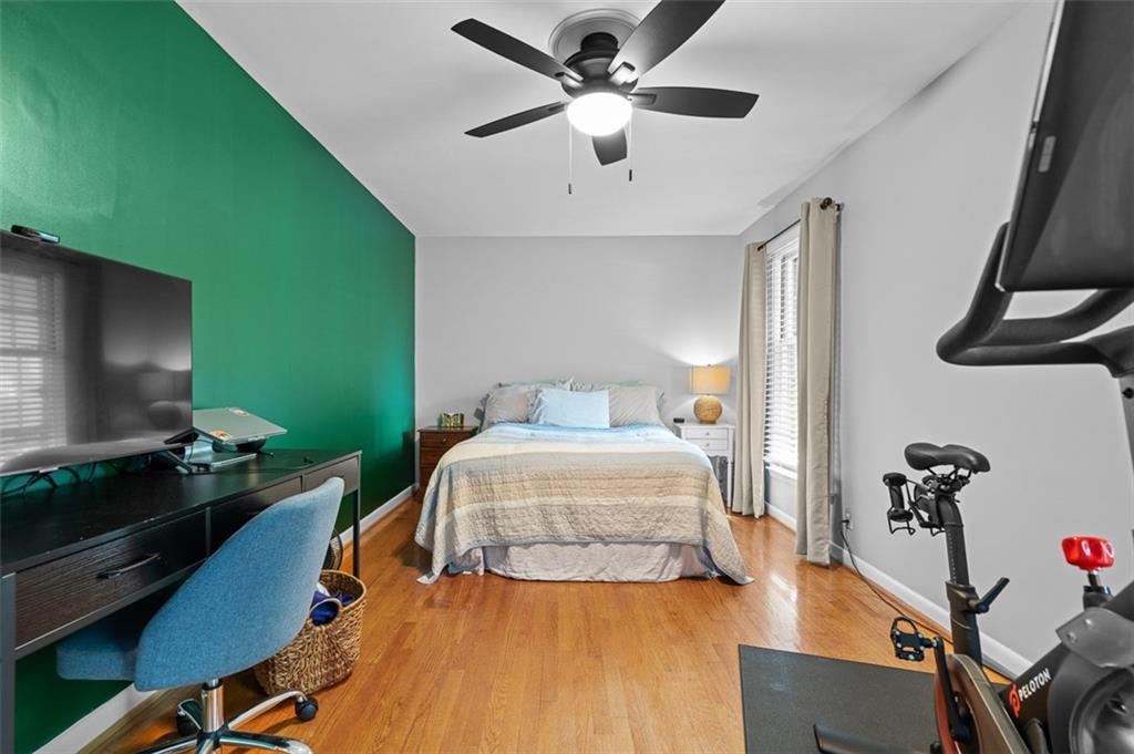 3698 Embry Circle Atlanta, GA 30341 - Photo 29 of 43 a bedroom with a bed and a chandelier