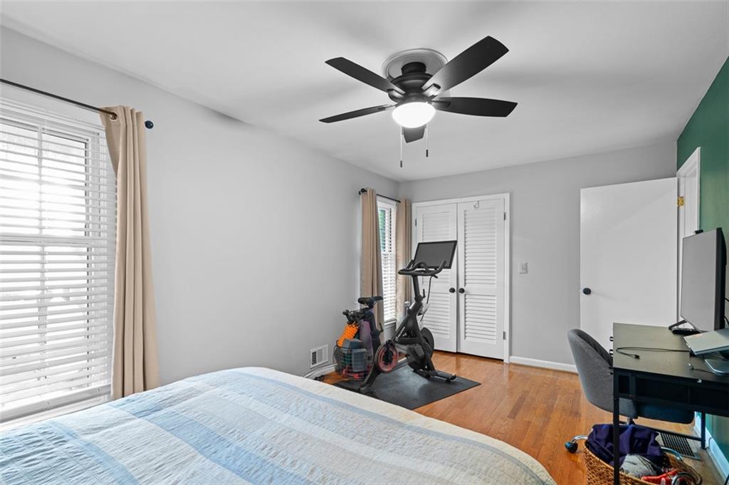 3698 Embry Circle Atlanta, GA 30341 - Photo 30 of 43 a bedroom with a bed and a chandelier