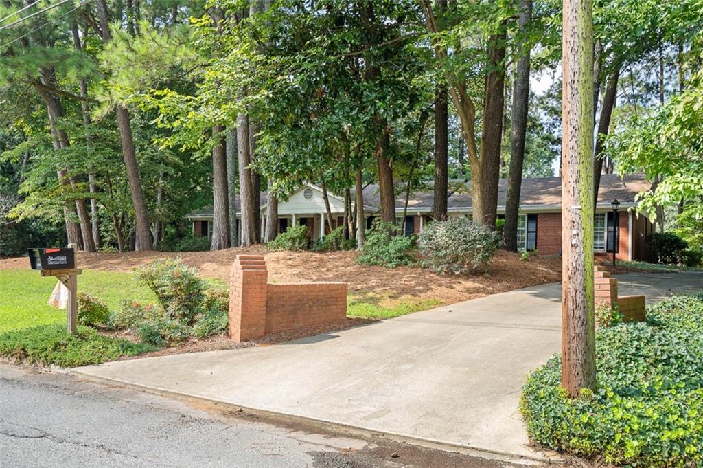 3698 Embry Circle Atlanta, GA 30341 - Photo 3 of 43 a view of a yard with plants and trees beside of it