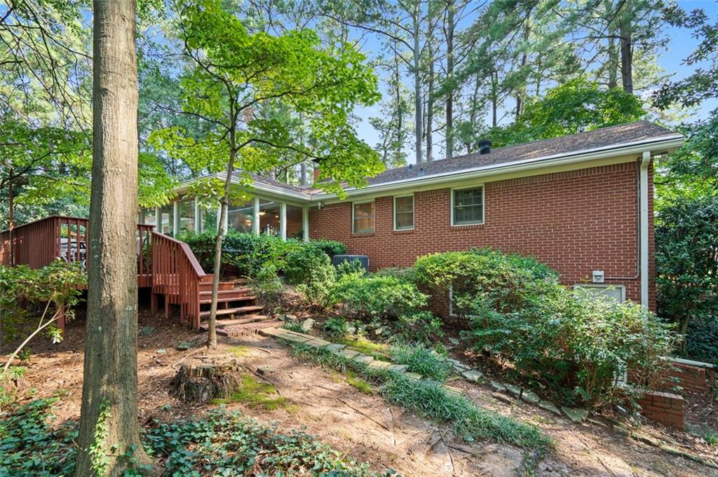 3698 Embry Circle Atlanta, GA 30341 - Photo 40 of 43 a view of a house with backyard sitting area and garden