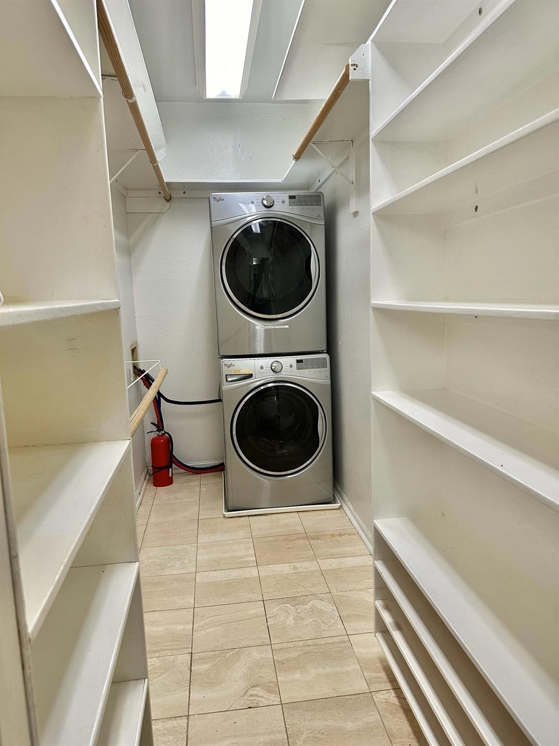2100 Tanglewilde Street, Unit 537 Houston, TX 77063 - Photo 12 of 13 a view of a kitchen with a sink and a utility room