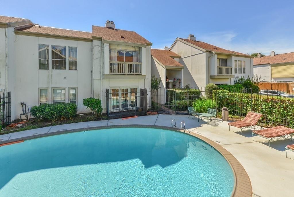 2100 Tanglewilde Street, Unit 537 Houston, TX 77063 - Photo 2 of 13 a view of a house with swimming pool and sitting area